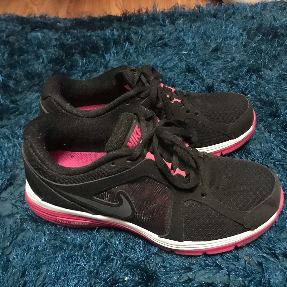 Black and pink Nike shoes